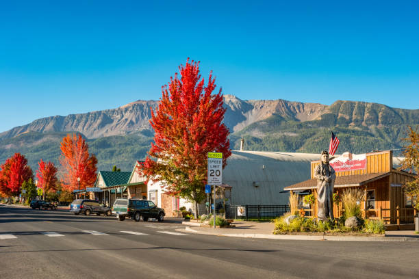 Street with the chamber of commerce and stores in downtown Joseph, Oregon, USA on a sunny morning.