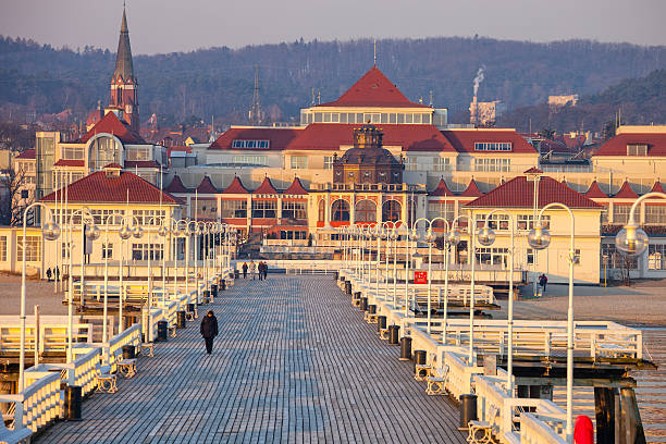 People walking on the Sopot Pier built in 1827. At 511m, the pier is the longest wooden pier in Europe.