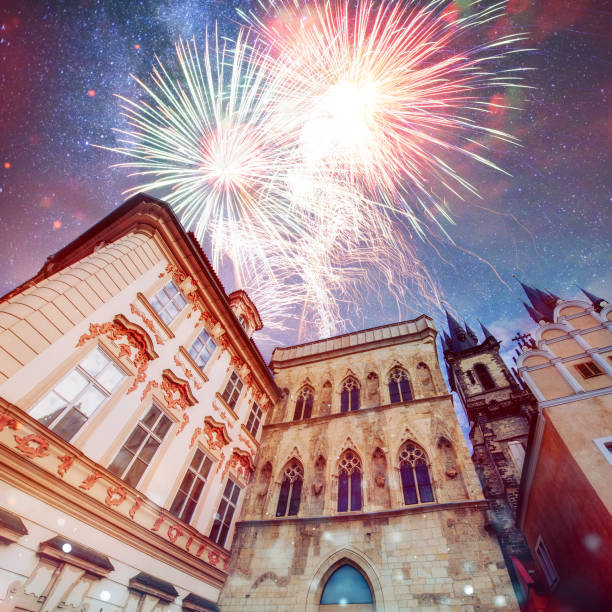 beautiful houses Czech Republic. Photo greeting card. Fantastic starry sky and the milky way. Colorful fireworks on the black sky background